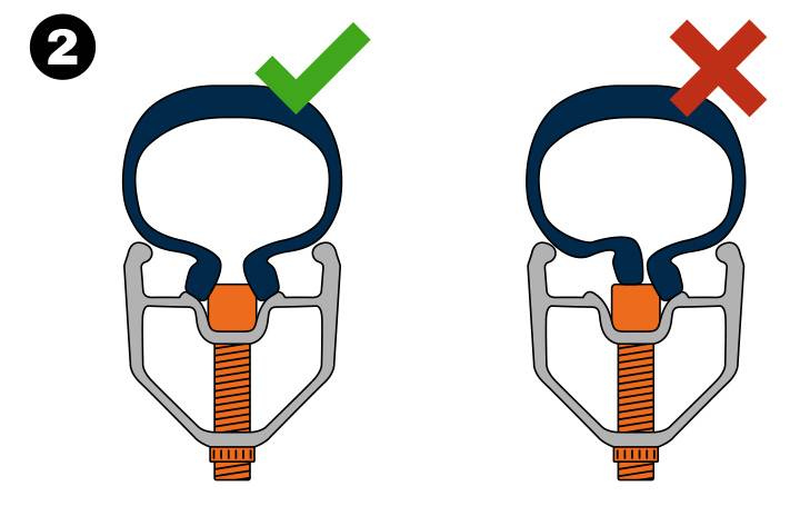 Make sure the valve is positioned between the beads as you inflate the tire.